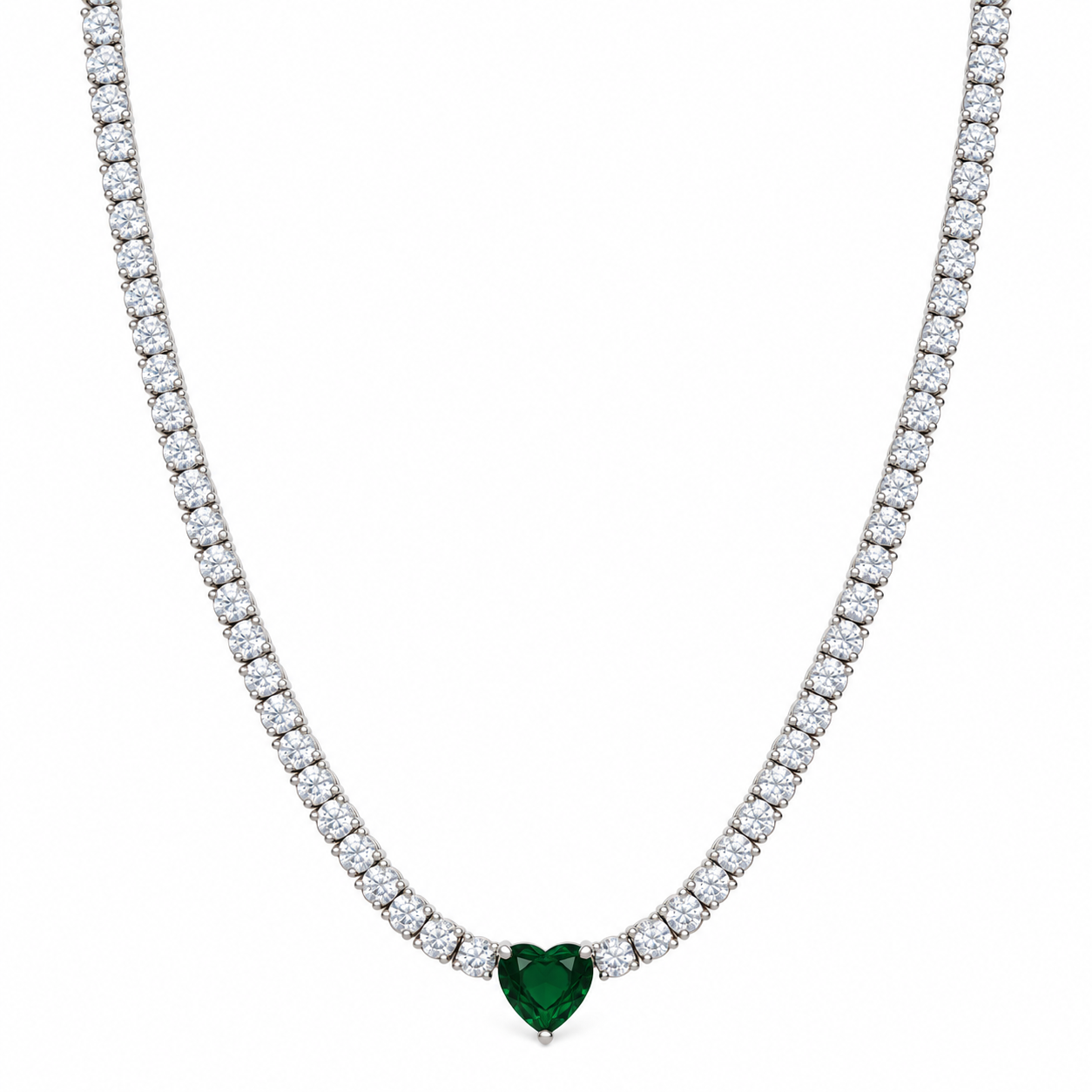 A tennis-style necklace with a heart-shaped green gemstone pendant, set in a silver-toned metal with a row of clear stones along the chain, shown against a plain white background.