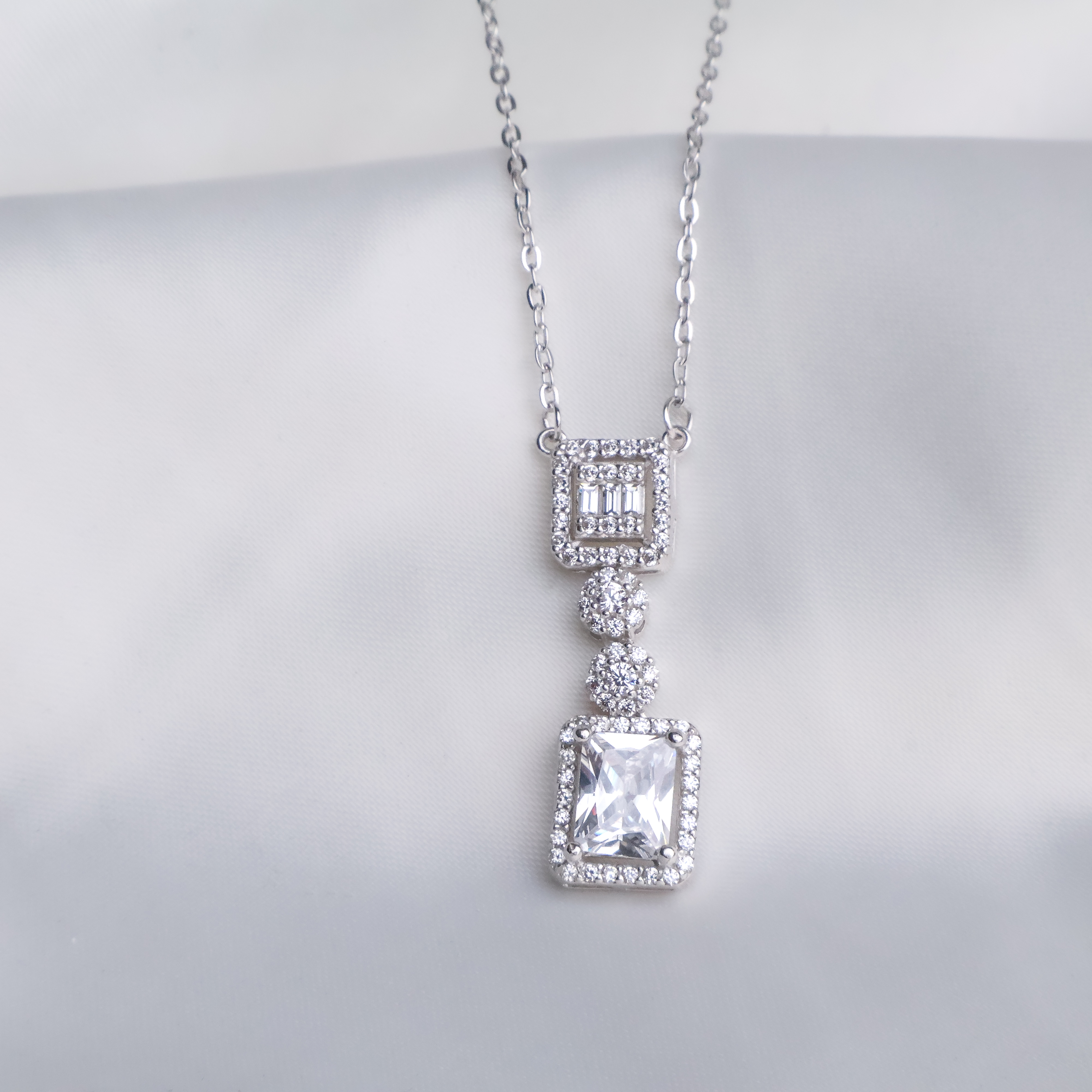 Regal Emerald-Cut Tiered Drop Necklace - 925 Sterling Silver Pavé Halo Pendant