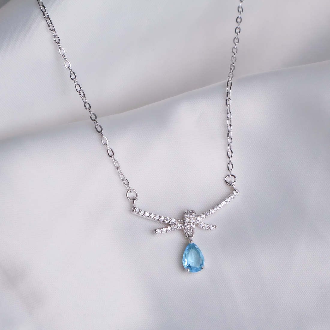 Aquamarine Droplet Bow Necklace - 925 Sterling Silver Pavé Ribbon Pendant